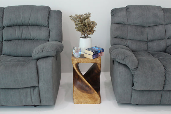 Original Twist Walnut end table between two gray armchairs with books and a vase